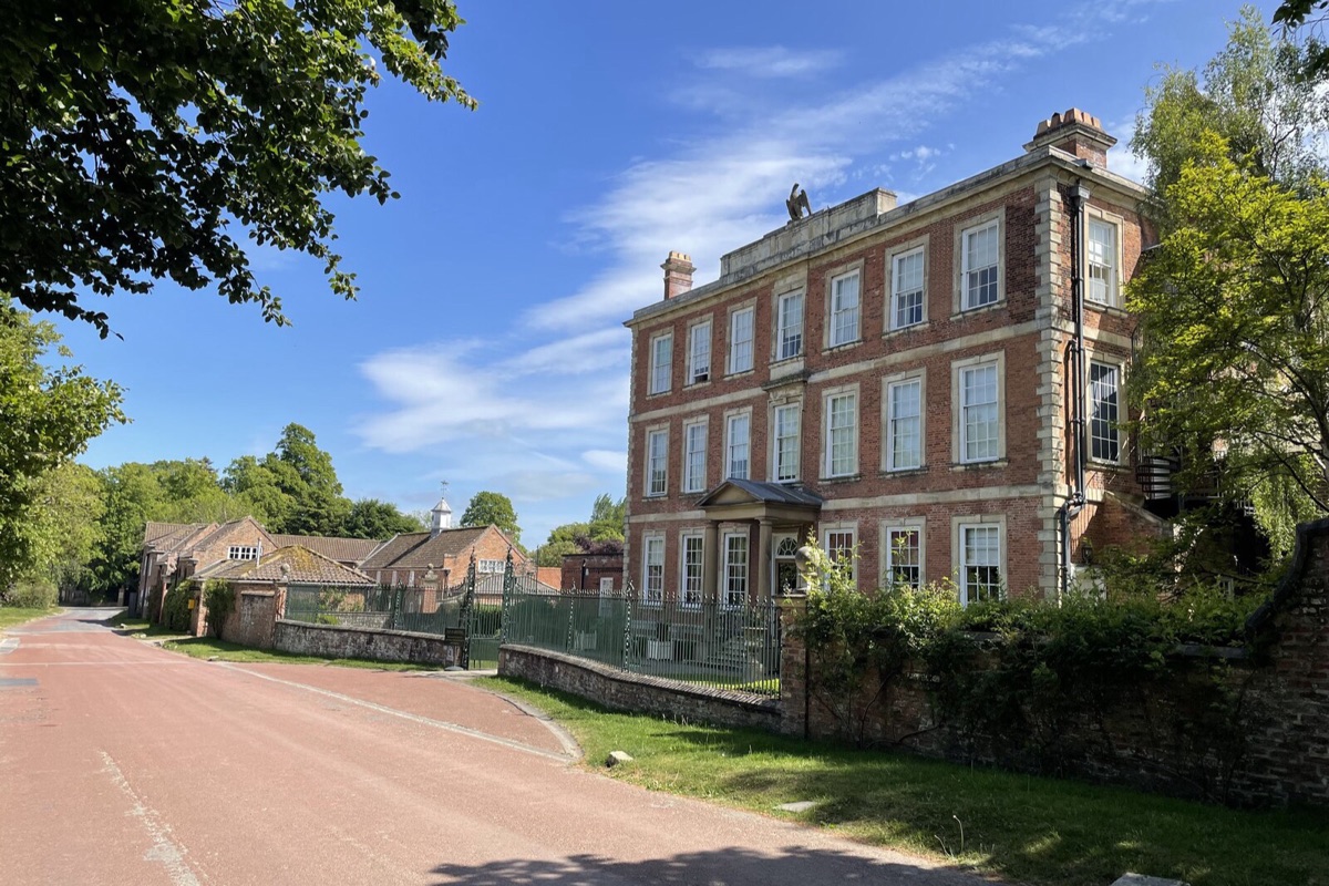 The red-brick front of Middlethorpe Hall behind its wall on Bishopthorpe Road