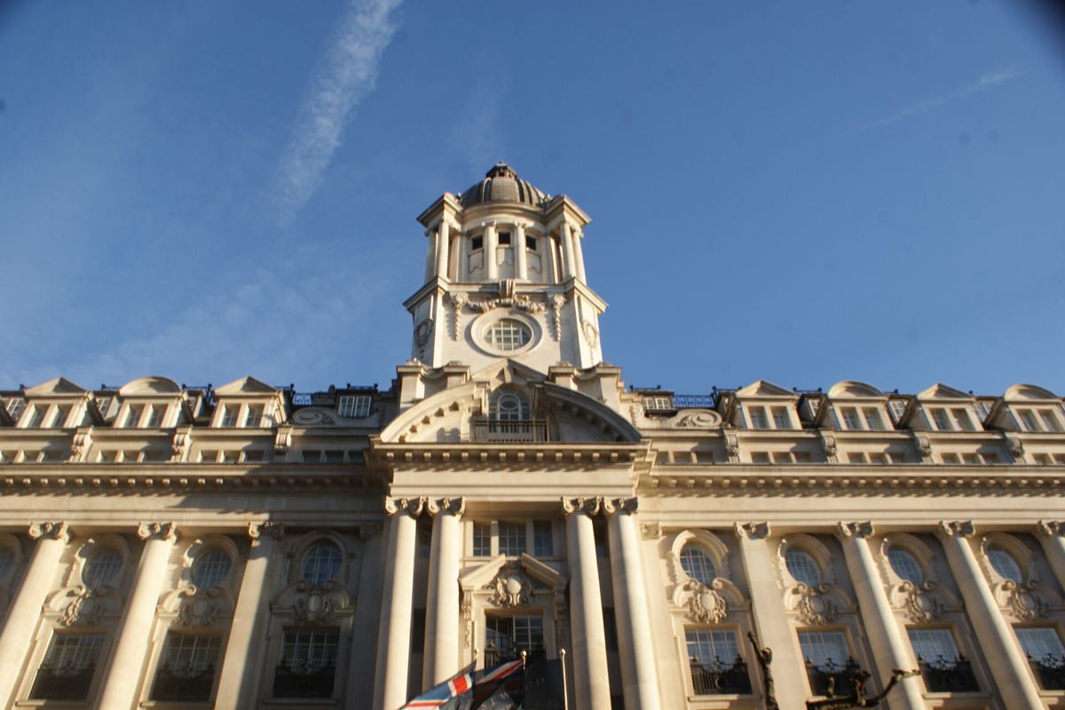 The stone gatehouse of Rosewood London on High Holborn