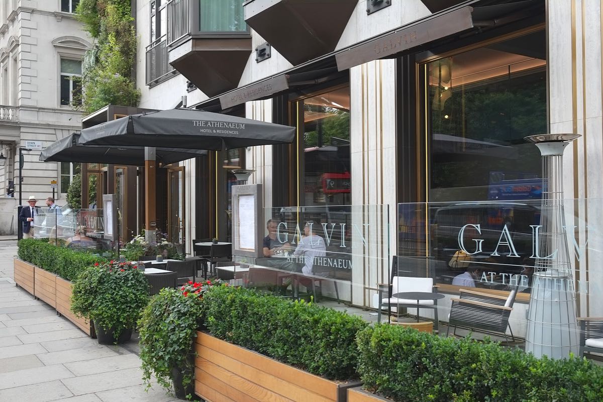 The hotel and restaurant entrance of The Athenaeum on Piccadilly, with planters outside