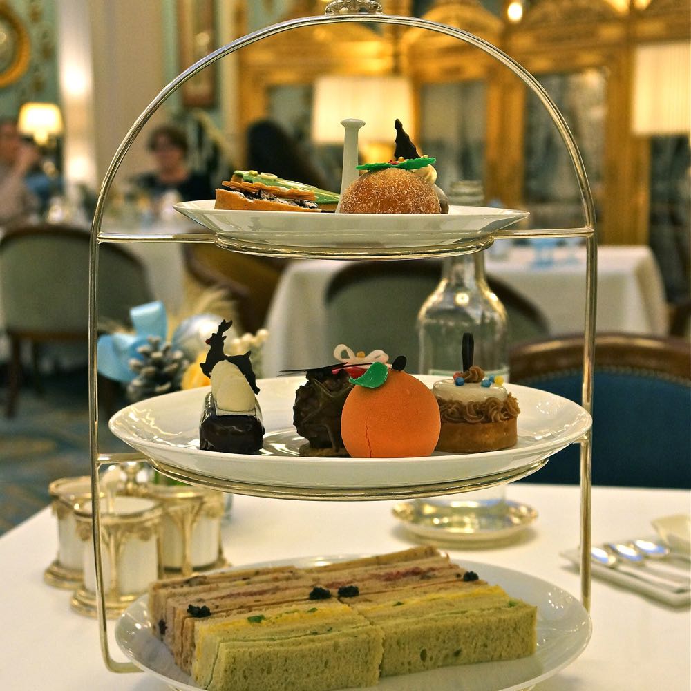 A three-tier stand of sandwiches, cakes and pastries at The Lanesborough's afternoon tea