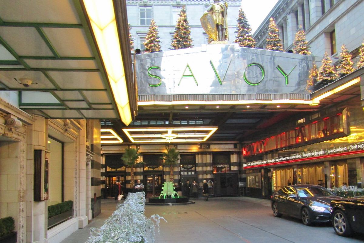 The Savoy's forecourt off the Strand, with the hotel's name above the entrance